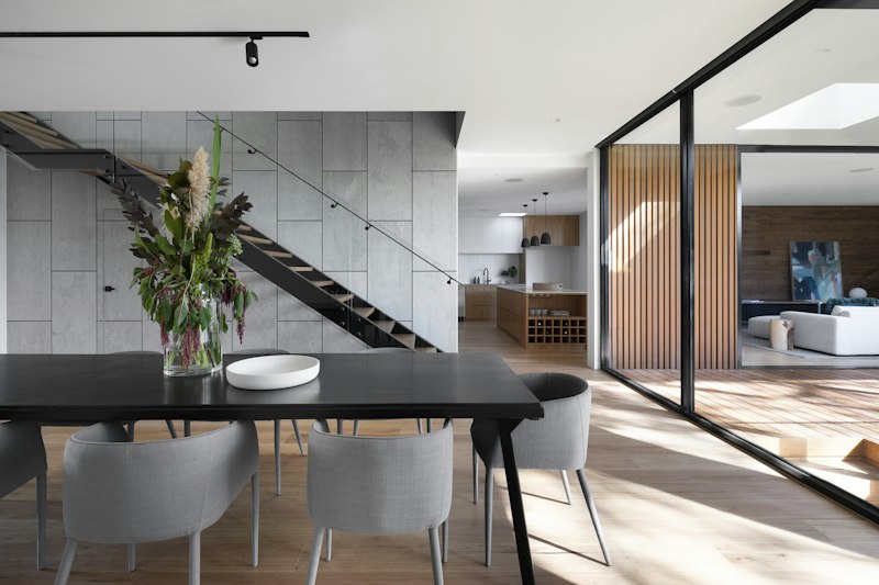An airy living and dining space opening onto a patio