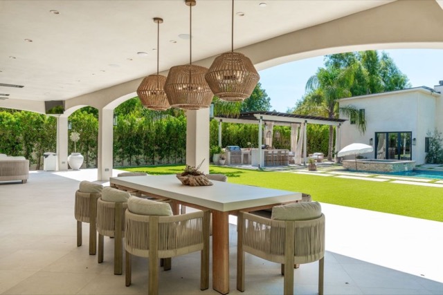 Outdoor dining area under a covered patio
