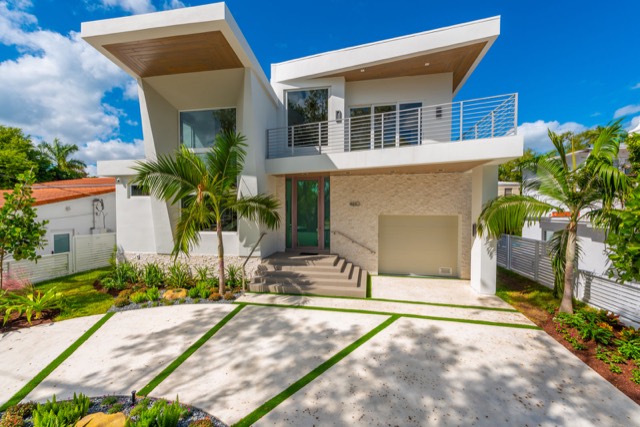 Modern two-story home exterior with flat roof lines