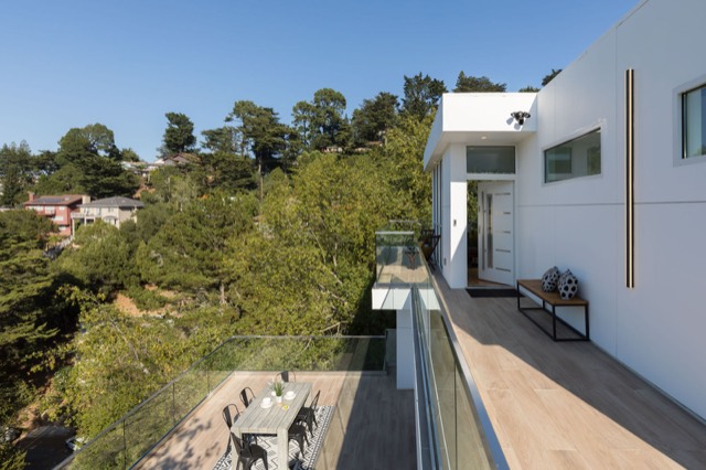 Wood-railed deck overlooking hills